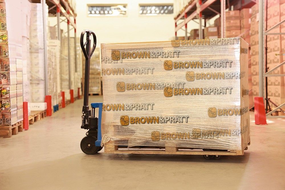 pallet of warehouse items shrink wrapped in Brown & Pratt branded shrink wrap
